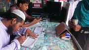 Mobile banking agent helps a customer in Bangladesh 