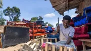 A carpenter works with his hammer in Nairobi, Kenya