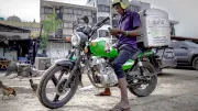 A delivery driver checks his delivery service platform in Lagos, Nigeria.