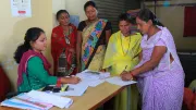 Women in India apply for a bank loan to start a business.